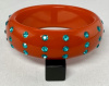 BB268 red orange bakelite bangle with turquoise rhinestones